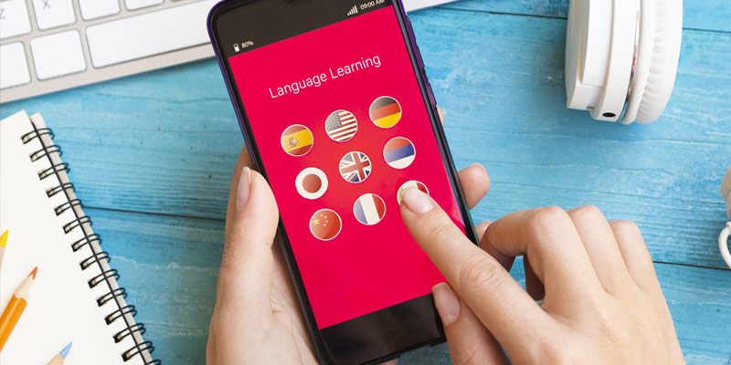 Smartphone with flags of countries, app to learn languages.