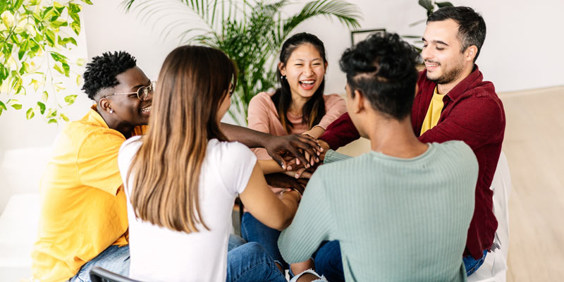 Group of diverse people playing a game with their hands