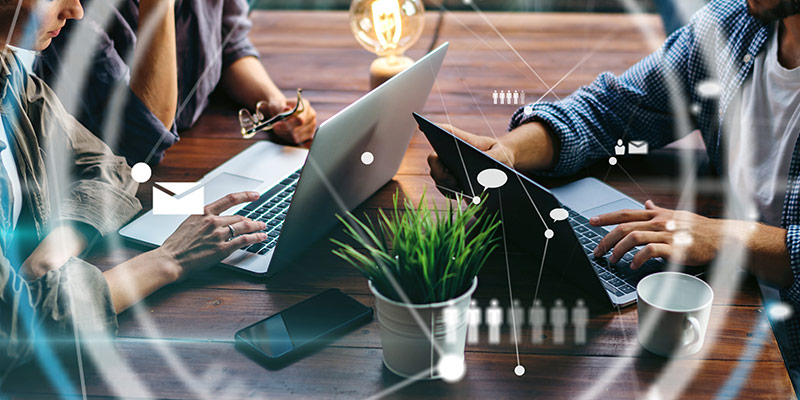 People learning with their laptops and different technologies