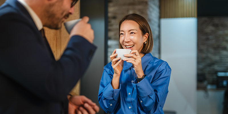 Two person drinking coffee and having an emotional conversation