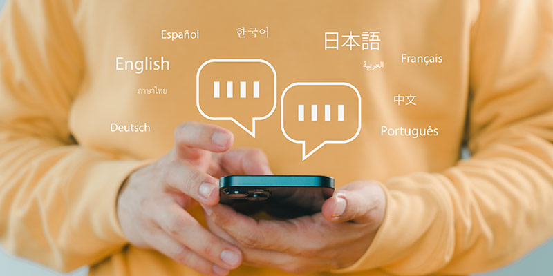 Person holding a smart phone and learning languages