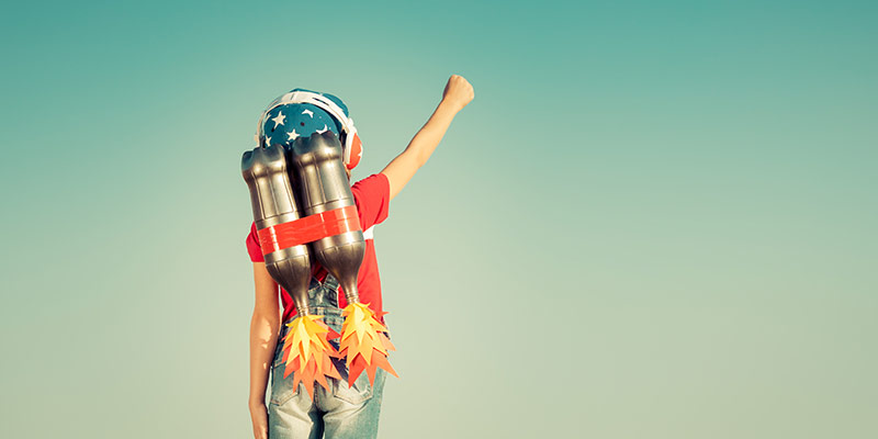 Child wearing a jetpack representing the future of language learning, innovation and limitless learning possibilities