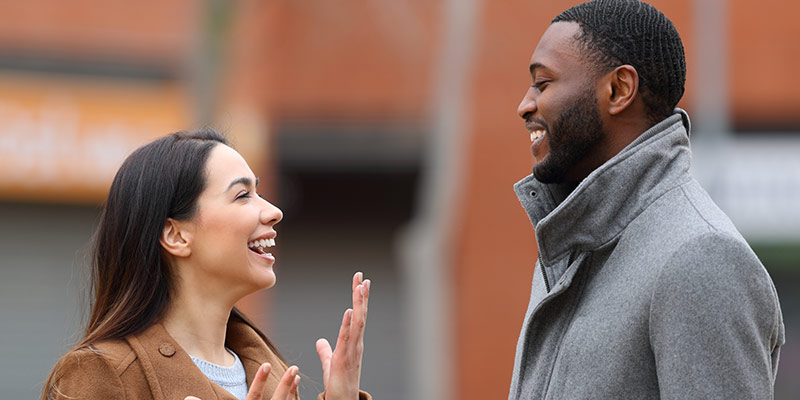 Two learners practicing personalized language learning through real-life conversation