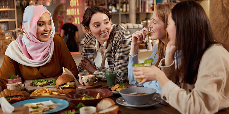 Real-world language learning through authentic social interaction