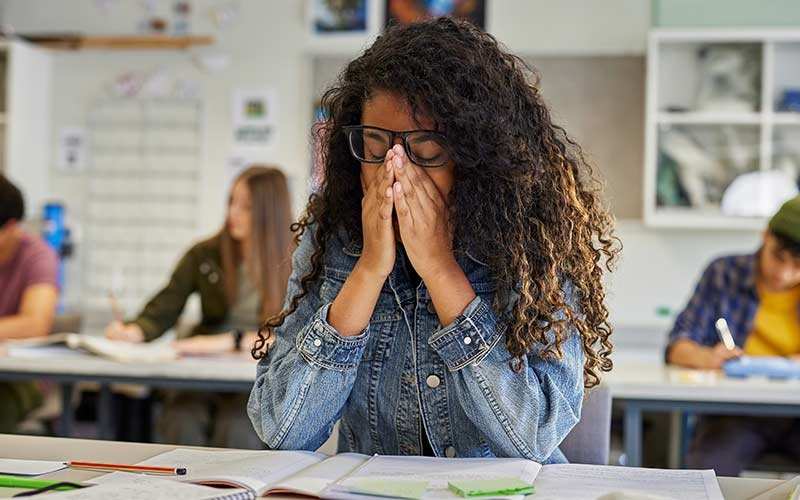 Learner feeling overwhelmed by a task, illustrating the importance of adapting language instruction to the right level of challenge