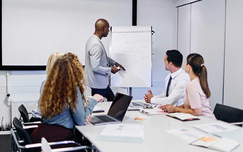 Professionals joining a Business English group course at work