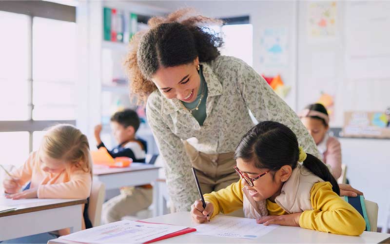 Language trainer helping a child progress at their own pace during a language lesson
