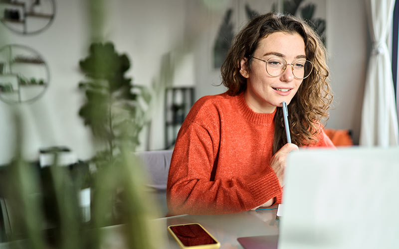 Learner participating in an online language lesson as part of a hybrid learning program
