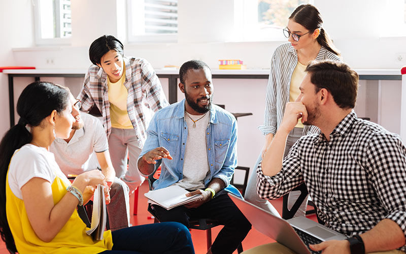 Language learners actively participating in a classroom discussion