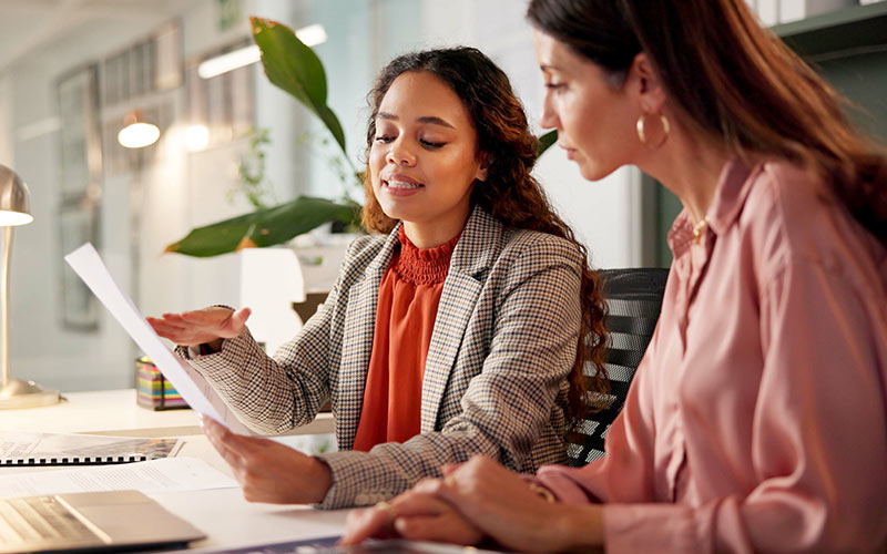 Manager discussing language learning progress and goals with an employee