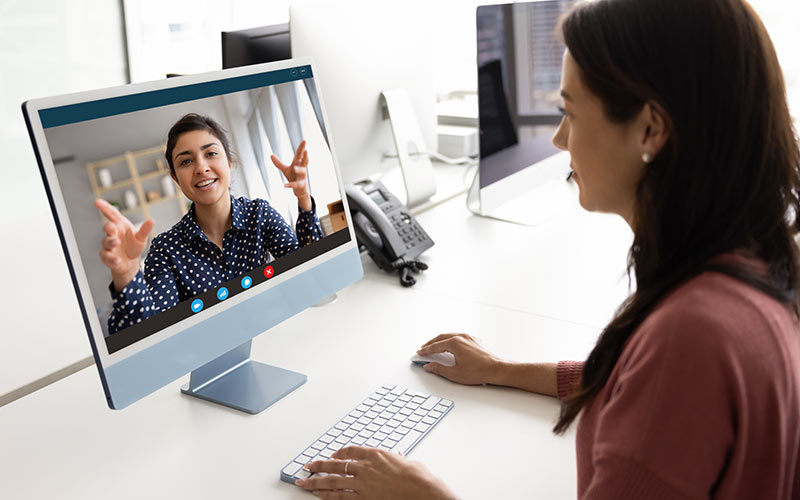 Learner participating in an online language training session with a trainer