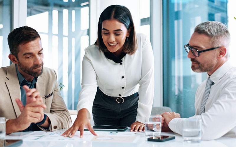 Professionals collaborating and communicating during an international business meeting