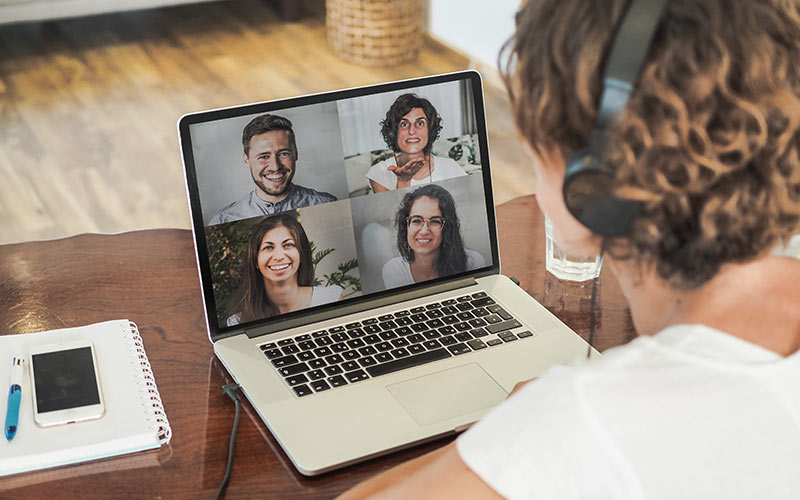 Learner participating in a small online language class with other learners