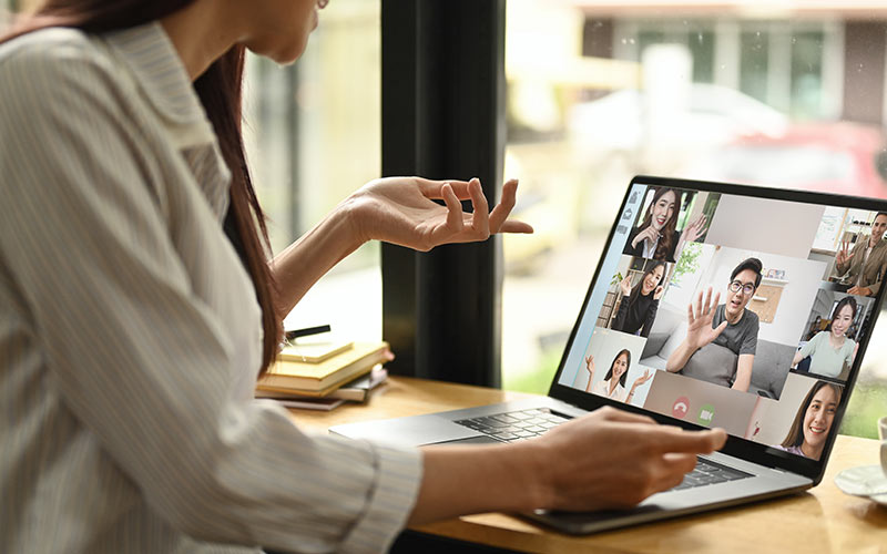 Learner practicing speaking with other learners during a live online language class