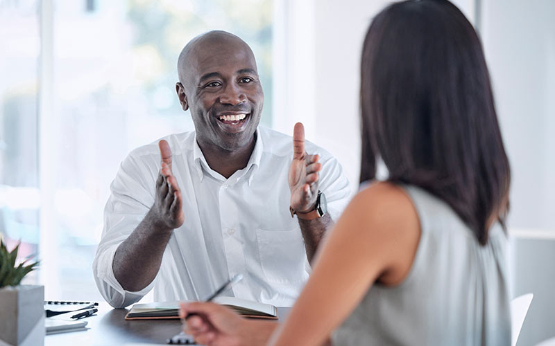 Learner receiving feedback on progress during a corporate language training session