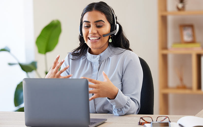 Learner actively participating in a live virtual language class by speaking during the lesson