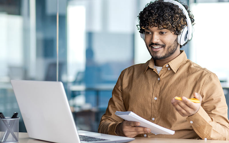 Employee taking part in a live online language lesson as part of blended corporate language training