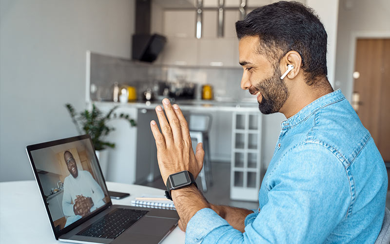 Learner practicing speaking during a live virtual language lesson with an online trainer