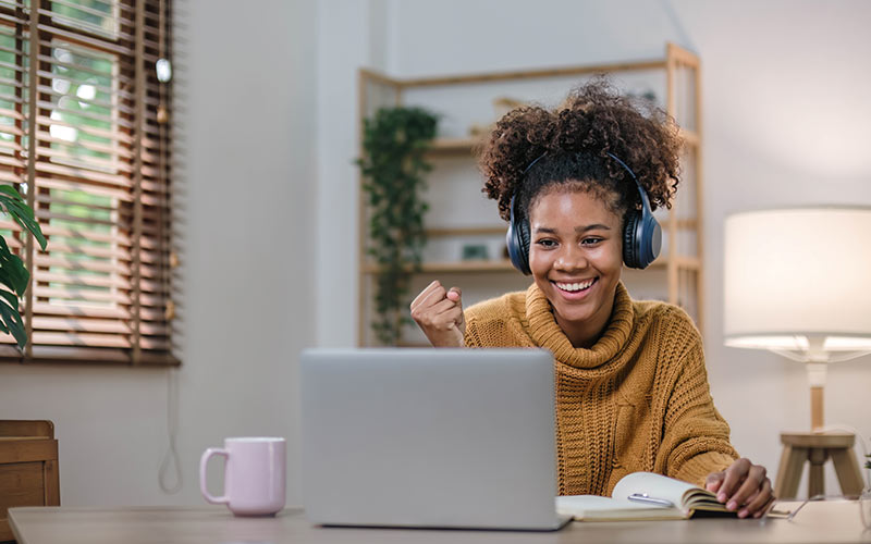 Motivated learner participating in an online language coaching session from home