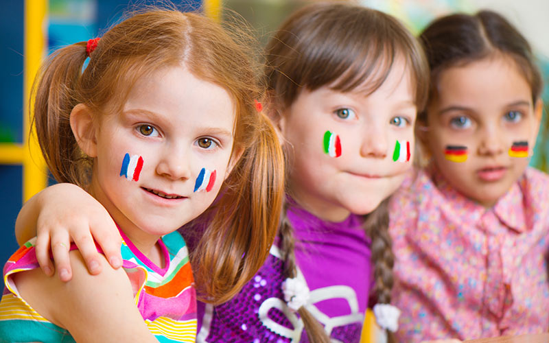 Children exploring different languages and cultures through a playful learning activity